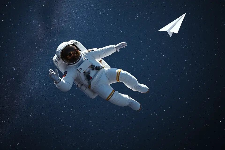floating astronaut paper airplane