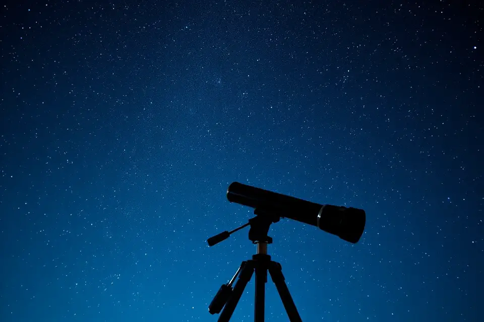 lone telescope under stars