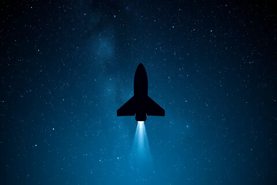 rocket silhouette starry backdrop