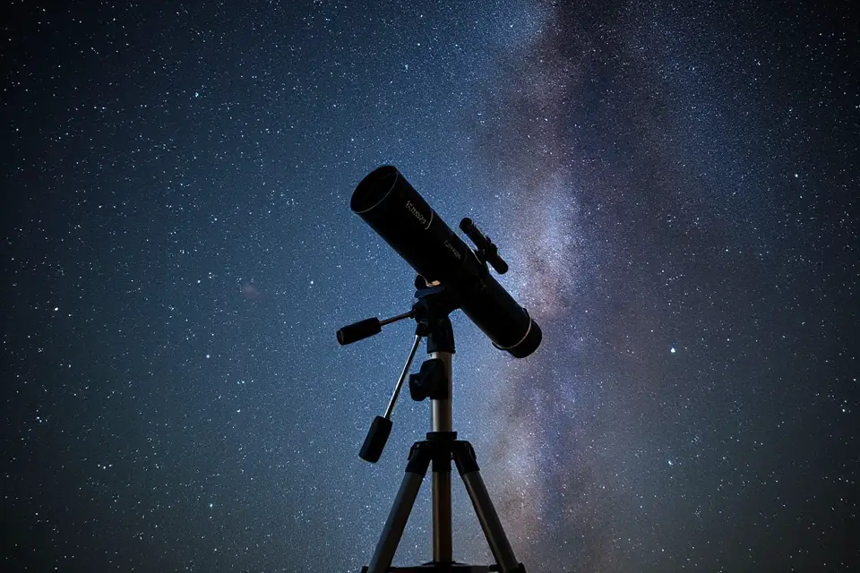 telescope under starry sky
